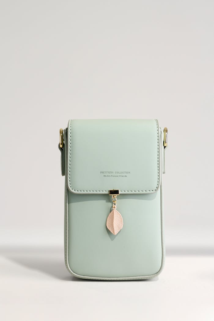 Elegant mint green handbag with a chic design, perfect for daily essentials and modern style.