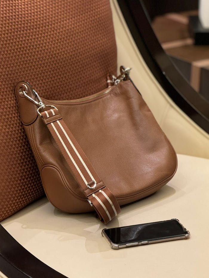Stylish brown leather handbag elegantly placed, perfect for fashion enthusiasts.