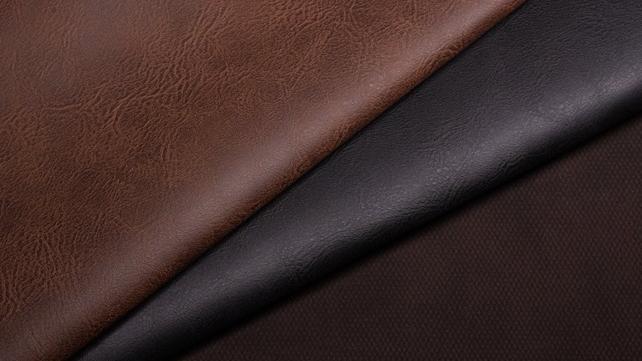 Detailed close-up of brown and black leather textures, perfect for fashion and design projects.